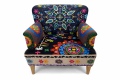 Intricate embroidered armchair with mandala design.png